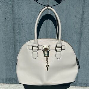 Apt 9 dome-shaped top-handle bag with gold hardware and a padlock charm.